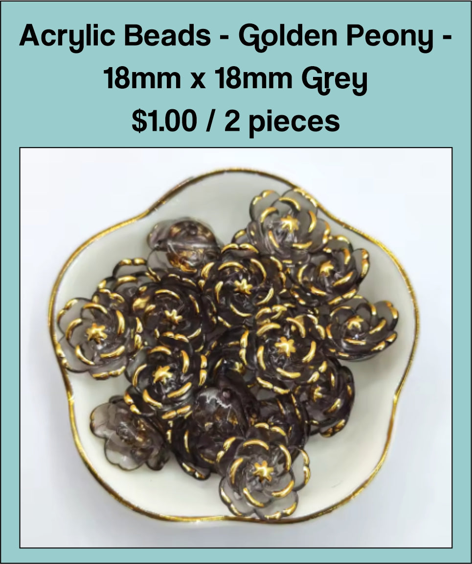 Dish of 18mm grey acrylic peony flower beads with gold-tone edging