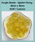 Dish of 18mm yellow acrylic peony flower beads with gold-tone edging
