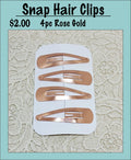 Card of four rose gold snap hair clips under a Snap Hair Clips heading