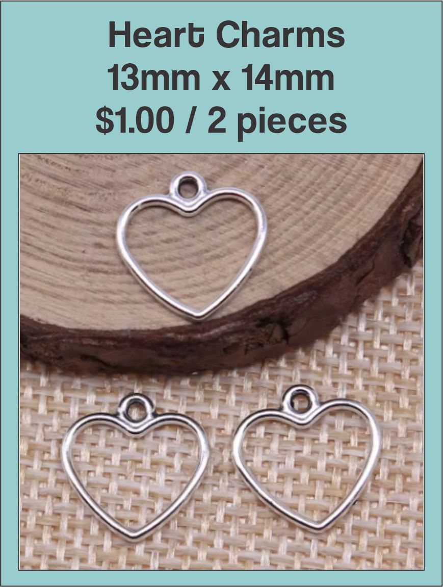 Silver-tone open 13 x 14mm heart charms on burlap on a labelled product card