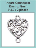 Silver-tone 15 x 19mm heart connector with a swirl pattern and loops at both ends