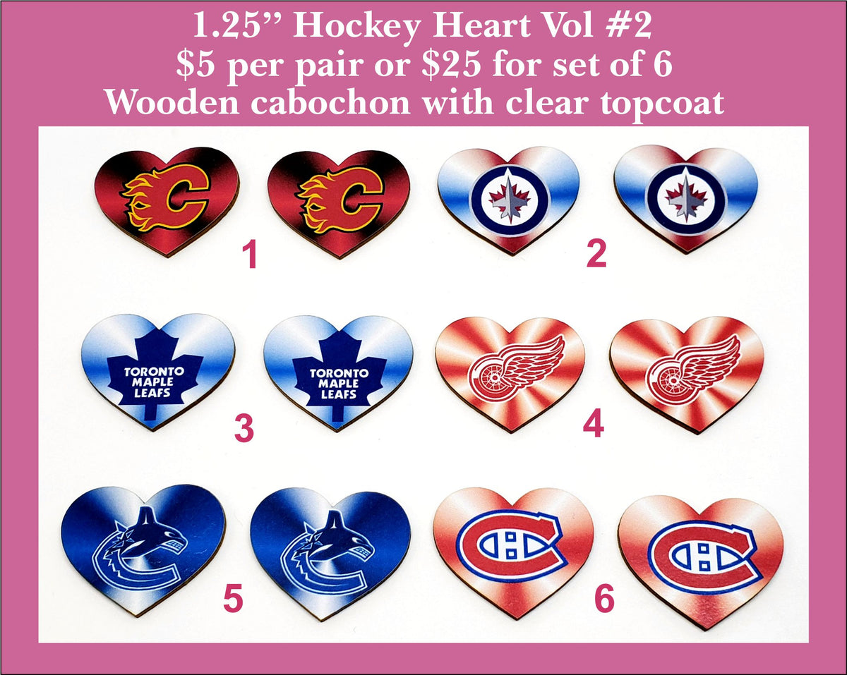 Six pairs of heart cabochons (cabs) printed with hockey team logos in red, blue and white