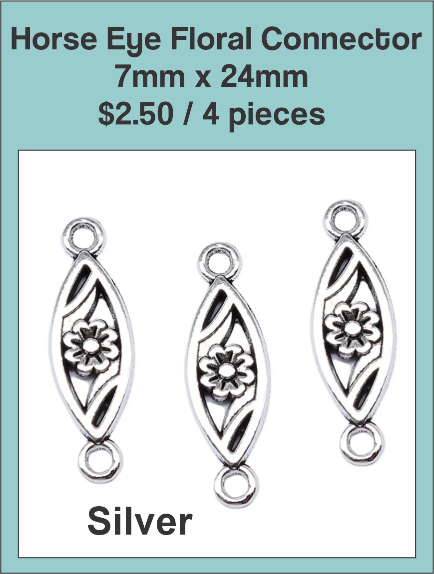 Three silver-tone 7 x 24mm horse eye connectors with a floral cut-out