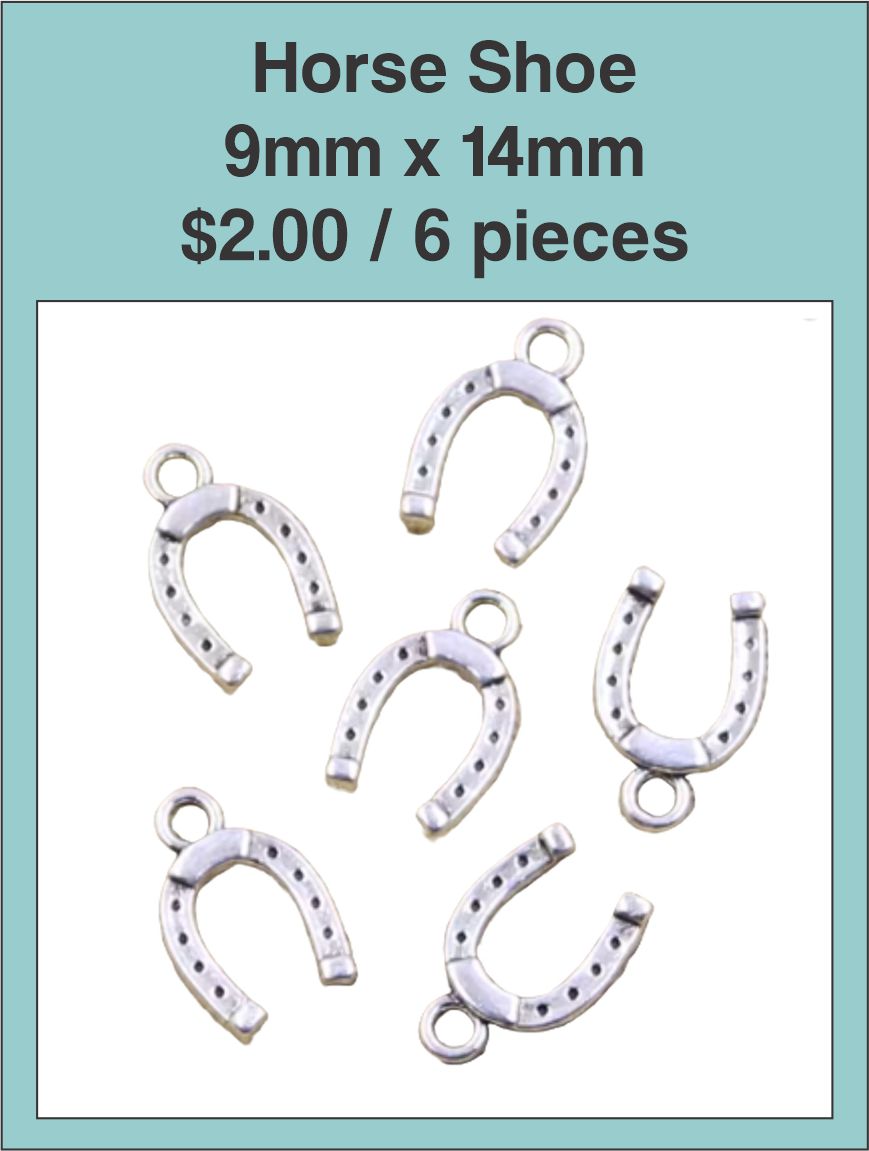 Six silver-tone 9 x 14mm horseshoe charms on a labelled product card