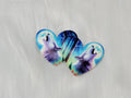 Pair of 37mm resin heart cabochons (cabs) with a howling wolf under northern lights