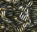 Close-up of loose twisted 6mm Preciosa Czech glass bugle beads in iris brown
