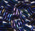 Close-up of loose twisted 6mm Preciosa Czech glass bugle beads in iris navy