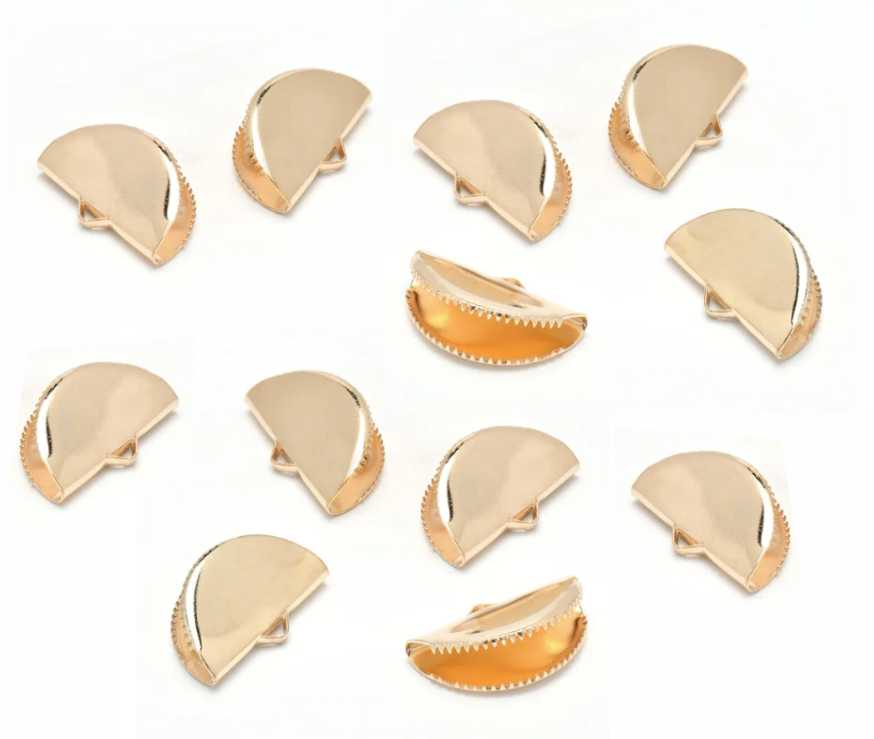 Pile of KC gold pinch crimp ends in 13mm and 20mm sizes on a white background