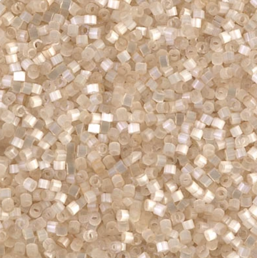 Close-up of Miyuki Delica 11/0 DB0673 cylinder beads in light cream with a silk satin sheen