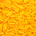 Close-up of loose 6mm Preciosa Czech glass bugle beads in light orange