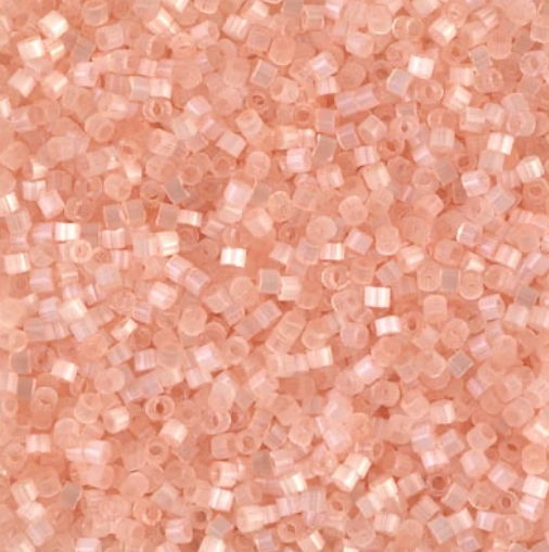 Close-up of Miyuki Delica 11/0 DB0824 cylinder beads in light peach with a silk satin sheen