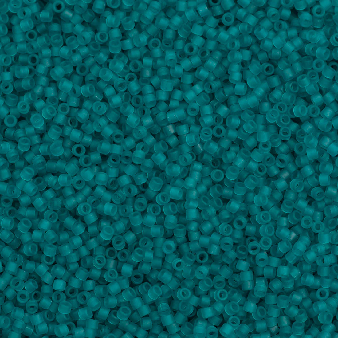 Close-up of Miyuki Delica 11/0 DB1268 cylinder beads in matte transparent caribbean teal
