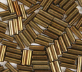 Close-up of loose 6mm Preciosa Czech glass bugle beads in metallic bronze