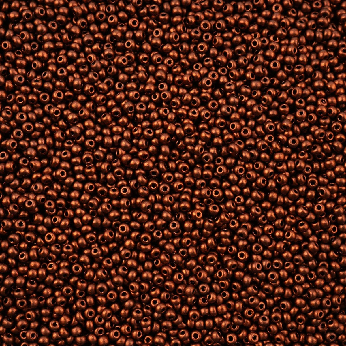 Close-up of Preciosa 11/0 Czech glass seed beads in metallic copper