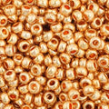 Close-up of Preciosa 11/0 Czech glass seed beads in metallic gold