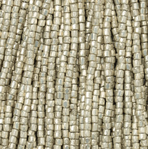 Close-up of strung Preciosa 9/0 three-cut glass seed beads in metallic light silver