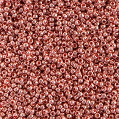Close-up of Preciosa 11/0 Czech glass seed beads in metallic pink solgel