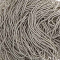 Close-up of strung Preciosa 13/0 true cut charlotte beads in metallic silver terra