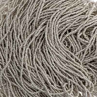 Close-up of strung Preciosa 13/0 true cut charlotte beads in metallic silver terra