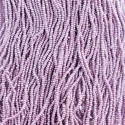 Close-up of strung Preciosa 13/0 true cut charlotte beads in metallic violet terra