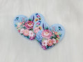 Pair of 37mm resin heart cabochons (cabs) in light blue with pink roses, blue hydrangeas and butterflies