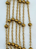 Gold-tone 2mm stainless steel chain with small round beads spaced along it