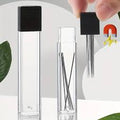 Clear needle tube with a black magnetic cap, and a hand lifting needles out with the cap