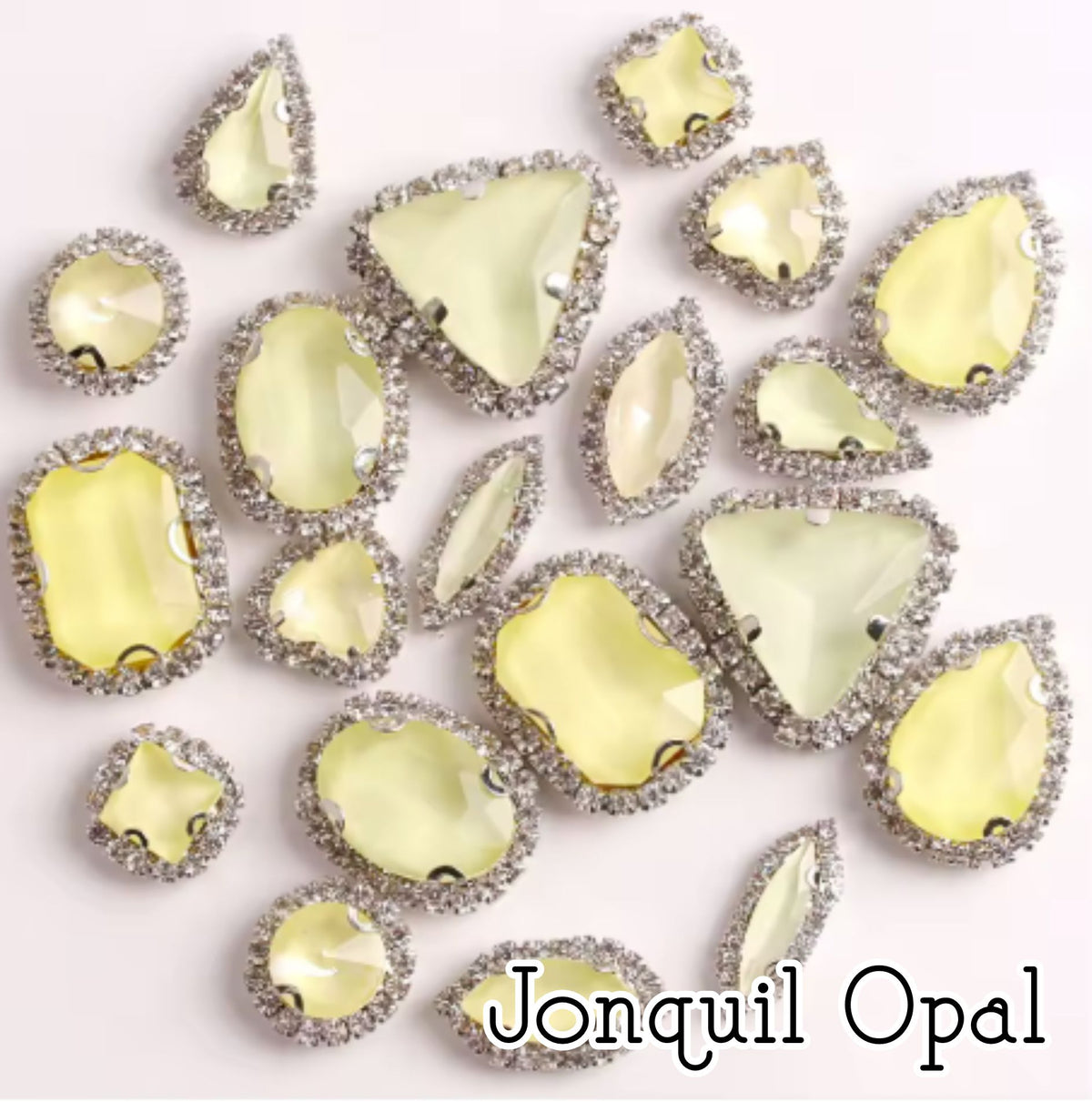 Sew-on crystal rhinestones in jonquil opal, in 10 shapes with silver claw settings