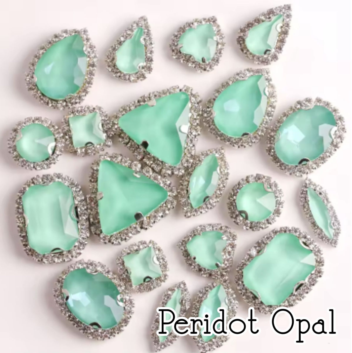 Sew-on crystal rhinestones in peridot opal, in 10 shapes with silver claw settings