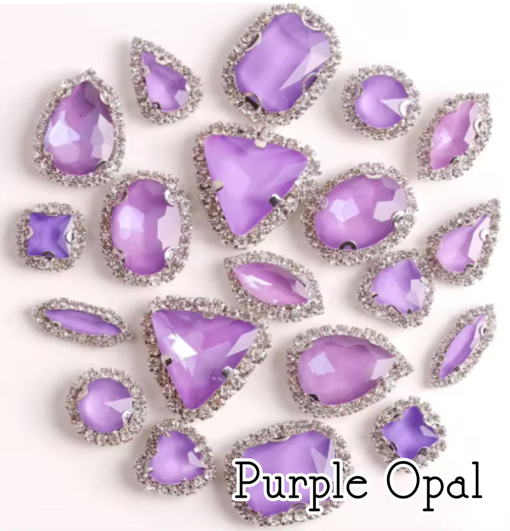 Sew-on crystal rhinestones in purple opal, in 10 shapes with silver claw settings