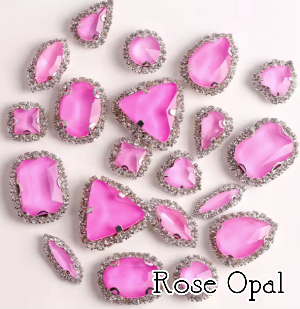 Sew-on crystal rhinestones in rose opal, in 10 shapes with silver claw settings