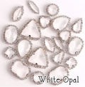 Sew-on crystal rhinestones in white opal, in 10 shapes with silver claw settings