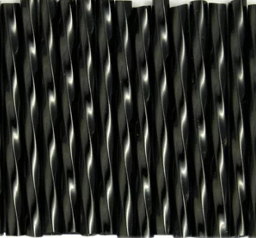 Rows of twisted 30mm Preciosa Czech glass bugle beads in opaque black