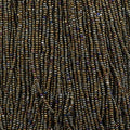 Close-up of strung Preciosa 13/0 true cut charlotte beads in opaque brown with an AB rainbow finish