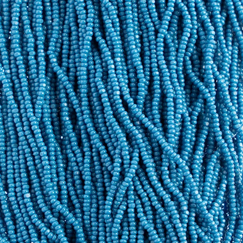 Close-up of strung Preciosa 13/0 true cut charlotte beads in opaque dark blue