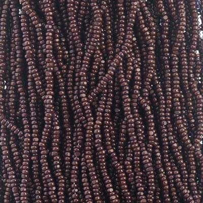 Close-up of strung Preciosa 13/0 true cut charlotte beads in opaque dark brown