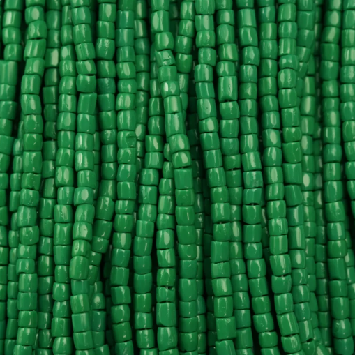 Close-up of strung Preciosa 9/0 three-cut glass seed beads in opaque dark green