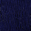 Close-up of strung Preciosa 13/0 true cut charlotte beads in dark royal blue