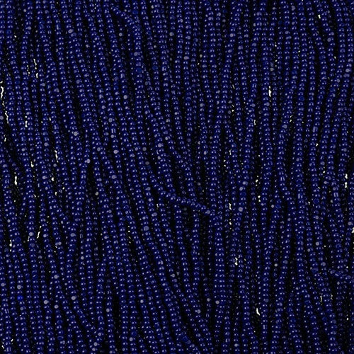 Close-up of strung Preciosa 13/0 true cut charlotte beads in dark royal blue