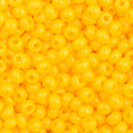 Close-up of Preciosa 11/0 Czech glass seed beads in opaque golden yellow