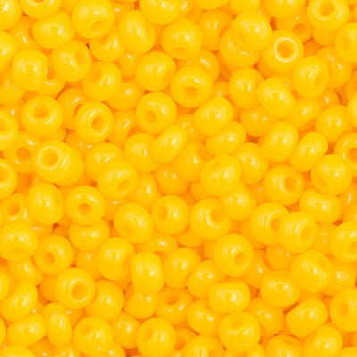 Close-up of Preciosa 11/0 Czech glass seed beads in opaque golden yellow