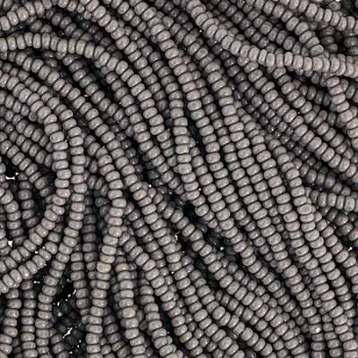 Close-up of strung Preciosa 13/0 true cut charlotte beads in opaque grey