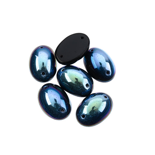 Five 13 x 18mm Czech glass oval cabs in opaque jet AB on a white background
