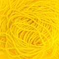 Close-up of strung Preciosa 13/0 true cut charlotte beads in opaque lemon yellow