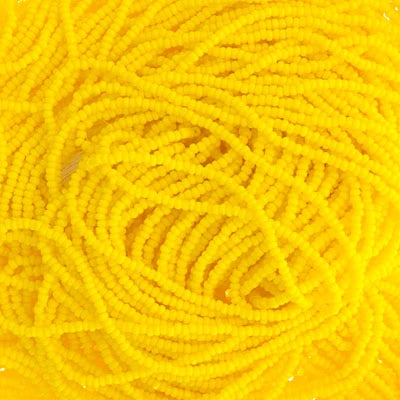 Close-up of strung Preciosa 13/0 true cut charlotte beads in opaque lemon yellow
