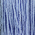 Close-up of strung Preciosa 9/0 three-cut glass seed beads in opaque light blue