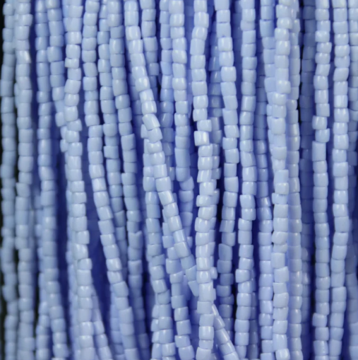 Close-up of strung Preciosa 9/0 three-cut glass seed beads in opaque light blue