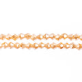 Two strands of Crystal Lane 4mm faceted glass bicone beads in opaque light champagne luster