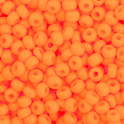 Close-up of Preciosa 11/0 Czech glass seed beads in opaque light orange