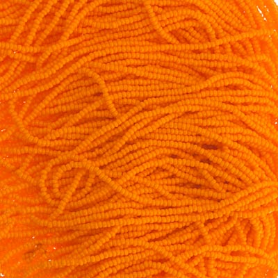 Close-up of strung Preciosa 13/0 true cut charlotte beads in opaque light orange